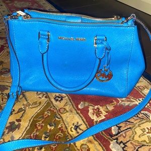Michael Kors crossbody with strap. Exterior is perfect interior could use clean